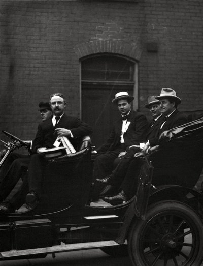 Edward F. Goltra, an unidentified delegate, Rolla Wells, and William Jennings Bryan arriving at a session of the 1916 Democratic National Convention, St. Louis, 11-14 June 1916 by J.C. Strauss